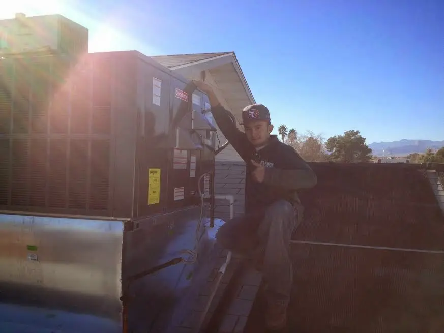 HVAC technician performing HVAC Inspection on a rooftop unit in Mount Horeb